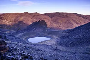 Glacial Prints: Sunset glow over alpine glacial lake near Pico del Caballo in Sierra Nevada National Park