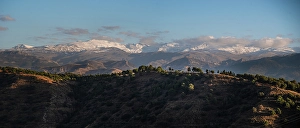 Hilly Prints: Sunset over hilly landscape in front of the Snowy Sierra Nevada