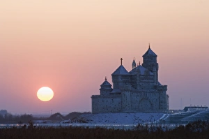 Images Dated 5th February 2008: Sunset over an ice sculpture of a Russian orthodox church replica at the Ice Lantern Festival