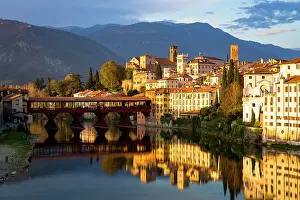 Ponte Vecchio Prints: Sunset over the iconic Ponte Vecchio bridge reflected in river Brenta