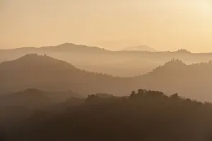 Sunset light reflected in the mist on countryside hills, Emilia Romagna, Italy, Europe