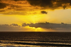 Images Dated 11th August 2010: Sunset lighting the clouds offshore from this village on the north west coast, El Cotillo