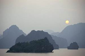 Enigma Prints: Sunset against limestone grotto islands