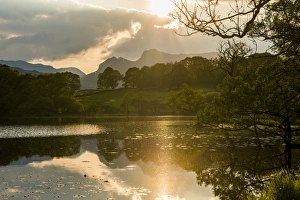 Sunset at Loughrigg Tarn near Ambleside, Lake District National Park, Cumbria, England