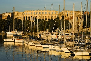 Stadium Prints: Sunset over marina to the Roman Amphitheatre, Pula, Istria, Croatia, Adriatic, Europe