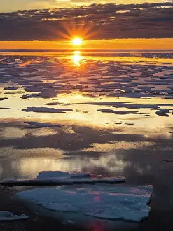 Nunavut Prints: Sunset over melt water pools in the heavy pack ice in McClintock Channel