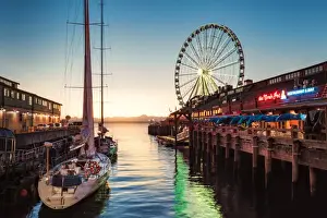 Ferris Wheel Prints: Sunset over mountains with Seattle Great Wheel on Pier 57 in the foreground. Seattle