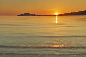 Stillness Prints: Sunset observed from Bantham showing Burgh Island and calm waters off the south coast of Devon in Great Britain