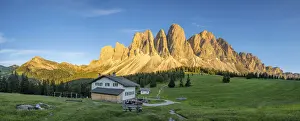 Sunset over Sass Rigais, Furchetta and Odle peaks seen from Glatsch Alm hut, Val di Funes
