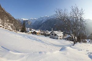 Soglio Prints: Sunset on the snowy village of Soglio, Maloja District, Bregaglia Valley, Engadine