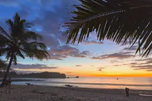 Sunset by the southern headland of beautiful Playa Pelada beach, Nosara, Nicoya Peninsula, Guanacaste Province, Costa Rica