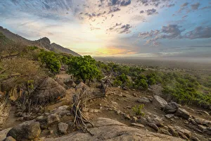 Thatched Roof Prints: Sunset over traditional huts of the Otuho (Lotuko) tribe, Imatong mountains