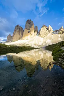Sunset over Tre Cime di Lavaredo mirrored in Grava Longa lakes