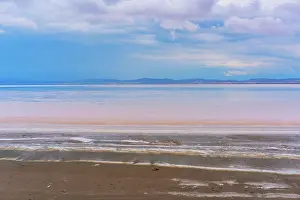 Wanderlust Prints: Sunset on Tuz salt lake with pink colors reflecting on water in Ankara, Turkey