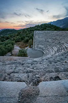 Theater Prints: Sunset view of ancient theater in Antiphellos with stone seating and surrounding landscape in Kas