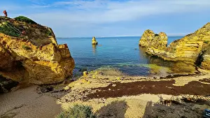 Atmosphere Prints: Sunset view of beach cliffs and calm water near Lagos with a clear sky in Algarve