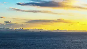 Fjords Prints: Sunset view over the blue water of the Norwegian Sea in Henningsvaer