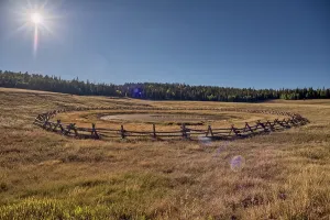 Fence Prints: Sunset view of Deer Lake Sinkhole on the Kaibab Plateau with wooden fence to keep cattle safe