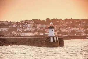 Navigation Prints: Sunset view of a harbor lighthouse in St