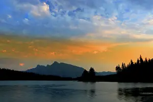 Alberta Prints: Sunset view at Jack Lake with mountains in the background near Banff Alberta Canada