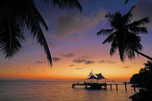 Atmosphere Prints: Sunset view near Coco de Mer resort on Praslin Island in Seychelles showcasing palm trees and a dock with a tent