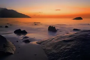 Retreat Prints: Sunset view over the ocean with rocks at the shore near Beau Vallon Beach in Seychelles