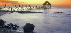 Atmosphere Prints: Sunset view over a pier with clouds and water at Pointe aux Piments in Mauritius at dusk