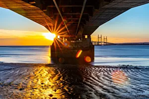 Mood Prints: Sunset view under a pier with sunburst effect