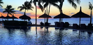 Time Prints: Sunset view from resort pool overlooking ocean at Pointe aux Piments Mauritius
