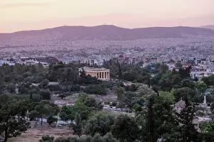 Athens Prints: Sunset view of the Temple of Hephaestus standing among trees in the Ancient Agora