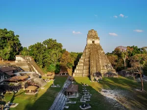 Landscaping Prints: Sunset view of Temple I at Tikal in Guatemala with surrounding structures and greenery