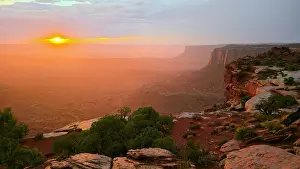 Canyonlands Prints: Sunset viewed from Grand View Point in Canyonlands National Park shows light spreading over desert landscape in Utah