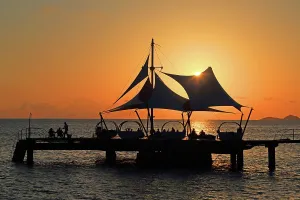 Silhouettes Prints: Sunset over water at Coco de Mer hotel near Praslin