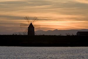 Images Dated 13th March 2008: Sunset over windmill on salt beds, Trapani, Sicily, Italy, Mediterranean, Europe