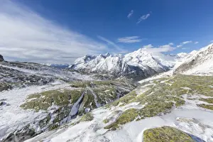Sunshine and snow at Alpe Fora with Monte Disgrazia in the background, Malenco Valley