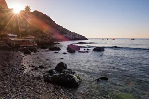 Taormina Prints: Sunstar at Isola Bella Beach at sunrise, Taormina, Sicily, Italy, Mediterranean, Europe