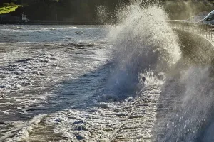 Front Prints: Surf crashes against the sea wall on the coast of the English Channel in Teignmouth