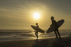 Bloubergstrand Prints: Surfers on Bloubergstrand at sunset, Cape Town, Western Cape, South Africa, Africa