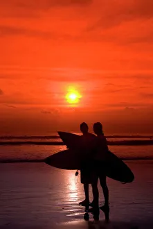 Leisure Activity Prints: Two surfers calling it a day, Kuta Beach, Bali, Indonesia, Southeast Asia, Asia