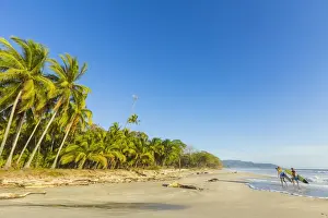 Togetherness Prints: Surfers on Playa Santa Teresa, a southern surf beach near Mal Pais, Nicoya Peninsula