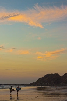 Nicoya Peninsula Prints: Surfers at sunset on Playa Guiones surf beach