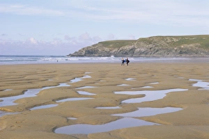 Surfer Prints: Surfers walking on beach, Holywell Bay, Cornwall, England, United Kingdom, Europe