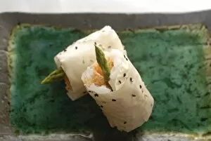Healthy Food Collection: Sushi appetizer of salmon and asparagas in rice and sesame parcel