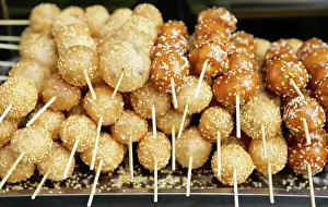 Traditionally Chinese Prints: Sweet snacks sold by vendors in the city parks of Sichuan Province come in colorful shapes