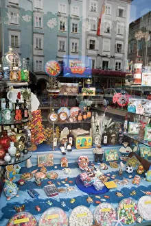 Glass Prints: Sweets and souvenirs in shop window, Salzburg, Austria, Europe