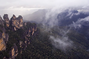 Blue Mountains Prints: Swirling mists around the Three Sisters rock outcrops at Katoomba