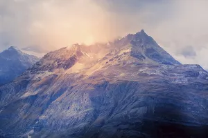 Evening Mood Prints: Swiss Alps mountain peaks dramatic sunset view, cloudy sky in Switzerland