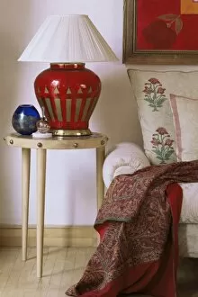 Images Dated 1st August 2008: Side table and hand blown glass based lamp beside sofa