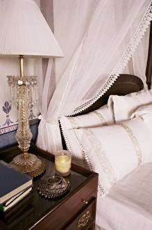 Ornament Prints: Detail of side table and four poster bed in bedroom