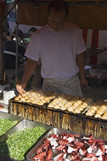 Snack Prints: Takoyaki octopus balls being made at monthly flea market